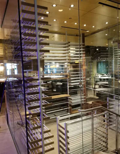 A glass door with shelves in it.