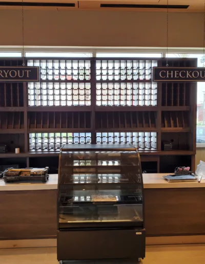 A bakery counter with a display of pastries.