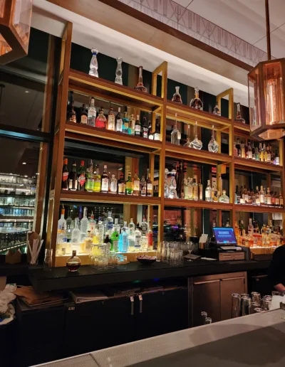A man standing behind a bar.