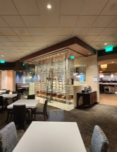 A view of a restaurant with tables and chairs.